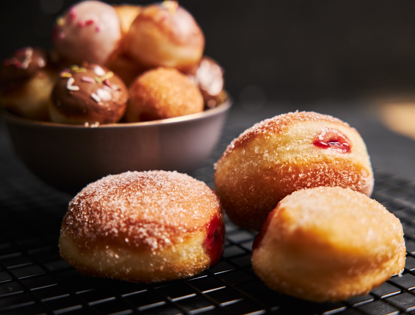 fried-donuts-with-sugar-cream-black-table.jpg